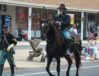 Colonel and Sgt Kilgore ready for children on the parade route 
